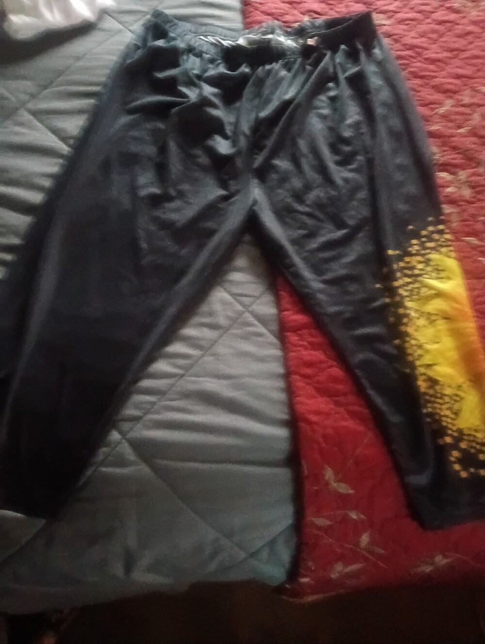 Women's Black Capri Pants with Yellow Sunflower Graphic Accent